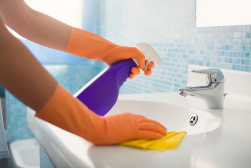 Professional house cleaning in a bright modern living room