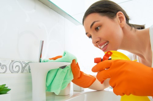 Kitchen house cleaning with organized countertops and sanitized surfaces