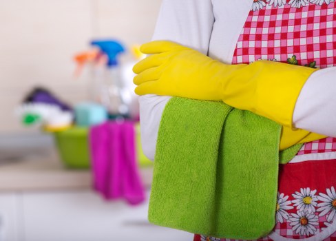 Cleaner living room showing the benefits of domestic cleaning